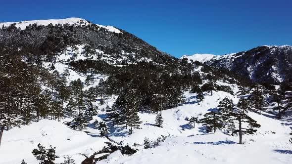 Moving over a snow covered mountain on a clear day