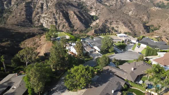 Exterior, aerial drone shot of mansion in Los Angeles