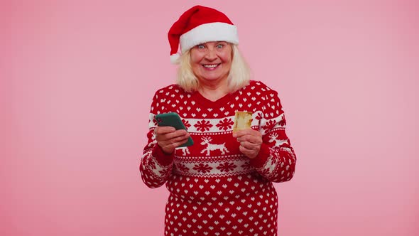 Senior Christmas Grandmother Woman Using Credit Card Smartphone Transferring Money Shopping Online