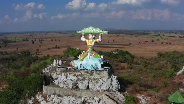 Aerial View of Wat Khao Samo Khon Temple with Hanuman Monkey God Statue on Top of Mountain in
