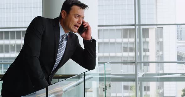 Businessman talking on mobile phone 