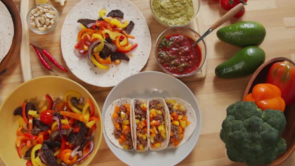 Mexican Tacos and Food Ingredients on Table