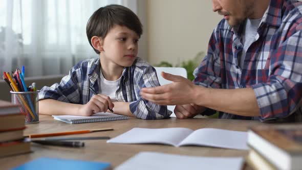 Father Scolding Son, Making Him to Do Homework, Boy Beginning to Write Task