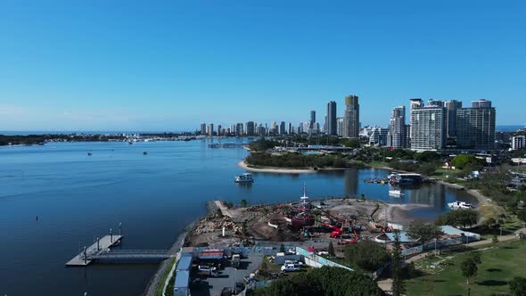 Construction of a new adventure park created on the foreshore with a city skyline backdrop High dron