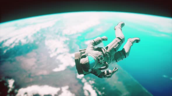 Astronaut Floating Above the Earth Elements of This Image Furnished By NASA alt