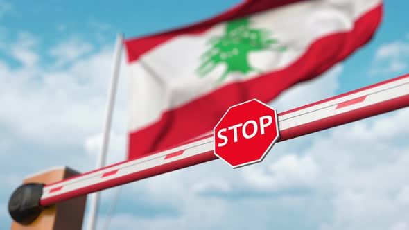 Opening Boom Barrier with Stop Sign at the Flag of Lebanon