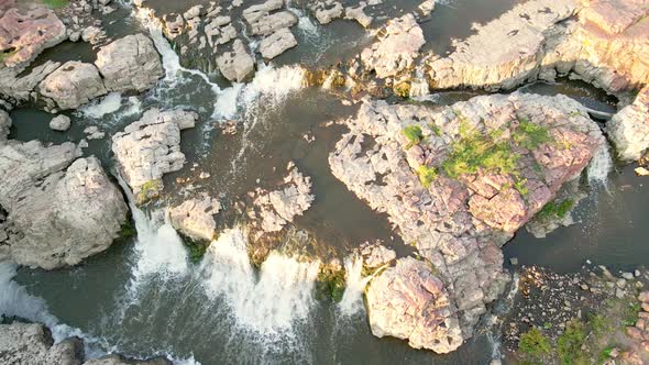 Top down view of waterfalls in Falls Park, South Dakota. Water in different paths through landscape