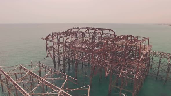 Fire damaged old burnt West Pier, Brighton, Sussex, England. Aerial drone view
