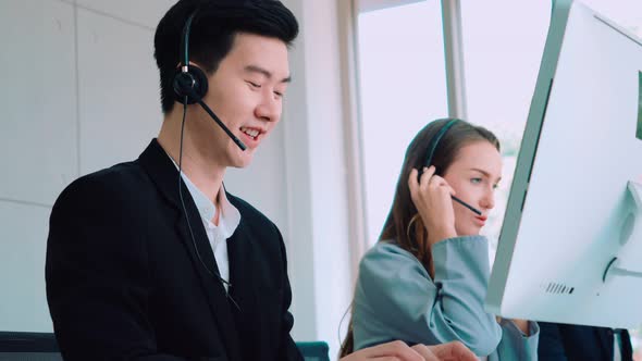 Business People Wearing Headset Working in Office