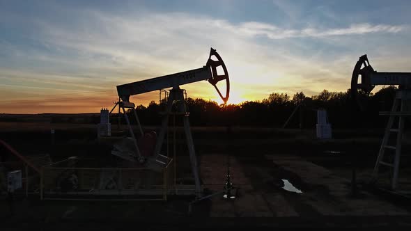 Flying Near Working Oil Pumps at Sunset