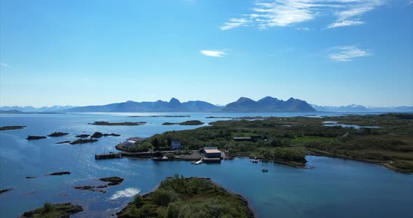 Arial pan shot over idyllic Islands on a nice sunny summer day in Northern Scandinavia, Europe Bo I