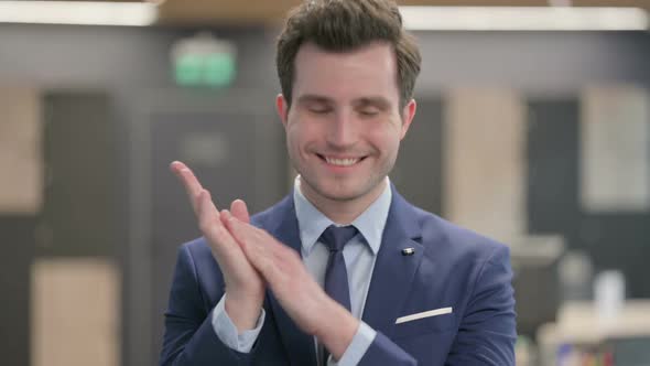 Portrait Shot of Happy Businessman Clapping Applauding