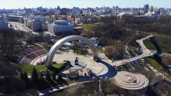 People Friendship Arch and Pedestrian Bridge of Klitschko. Reunion Arch in Kyiv, Ukraine. Aerial