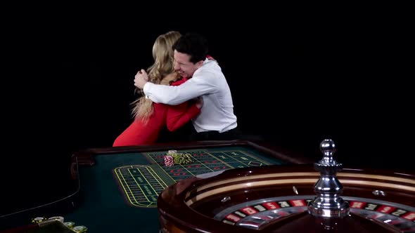 Couple Playing Roulette Is Eager To Win at the Gambling House. Black