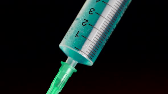Taking Vaccine Into A Glass Syringe From A Ampule