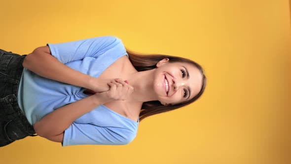 VERTICAL VIDEO POV Happy Woman Jumping Crossed Fingers and Connected Hands Having Good News