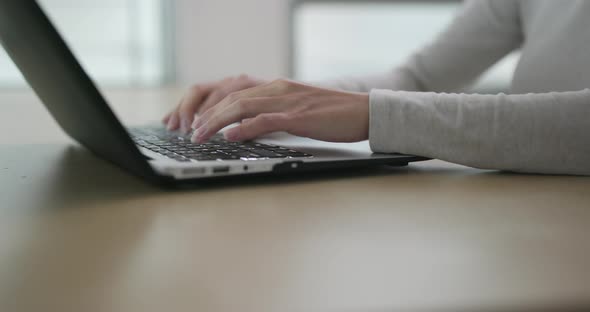 Woman working on laptop computer