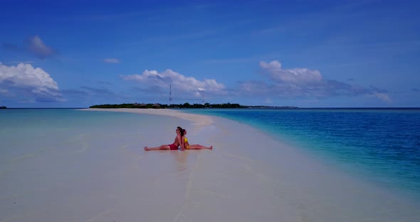 Romantic boy and girl on honeymoon vacation have fun on beach on summer white sandy background 4K