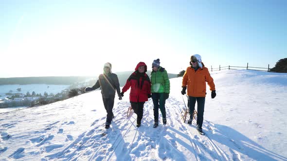 Four Happy Seniors Walking in Snow
