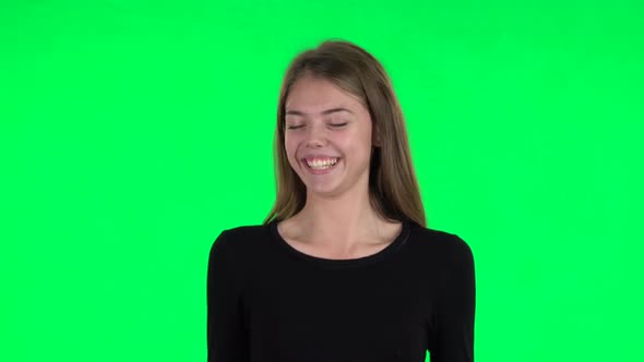 Young Woman Throwing Up Hands Expressing She Is Innocent. Green Screen