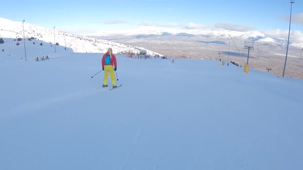 Woman Is Skiing at a Ski Resort