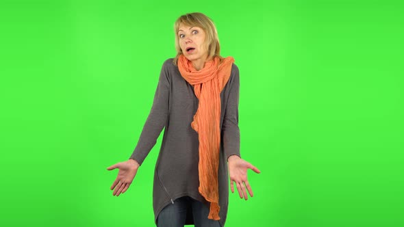 Middle Aged Blonde Woman Is Saying Oh My God and Being Shocked. Green Screen