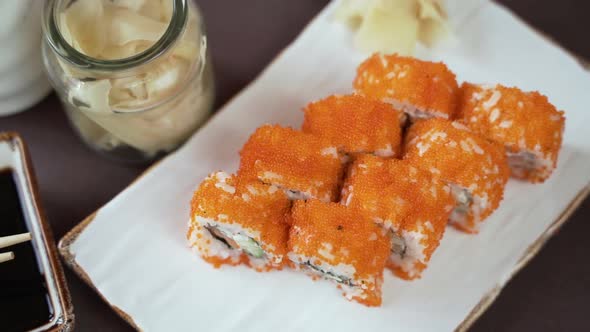 Sushi with cucumber, salmon and red caviar