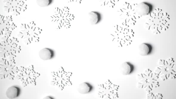 Christmas Toy White Snowflakes Rotate on White Background with Place for Text