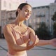 Ballerina Makes Graceful Smooth Moves with Hands on Street - VideoHive Item for Sale