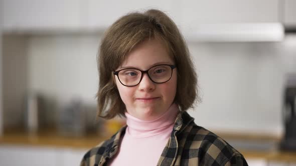 Cheerful Kid Smiling at Camera at Home