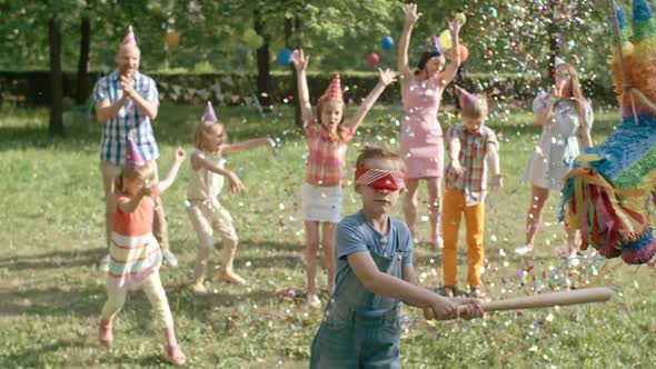 Hitting Pinata at Birthday Party