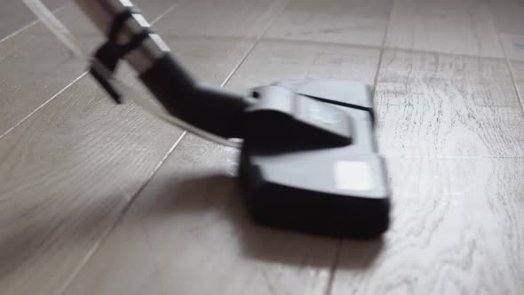 Vacuuming the Light Oak Floor with Water