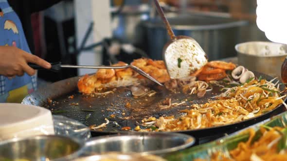 Preparation fresh delicious food at the night market, slow motion