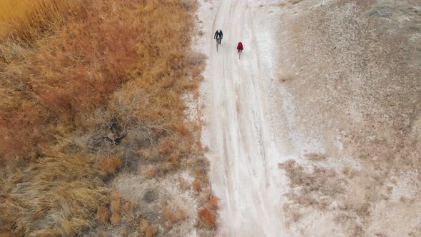 Drone Shot of Bicyclist Ride in Desert Road in Kazakhstan