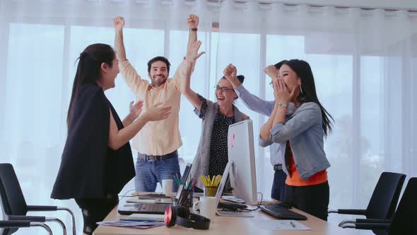 Successful Business People Celebrating Project Success at Office
