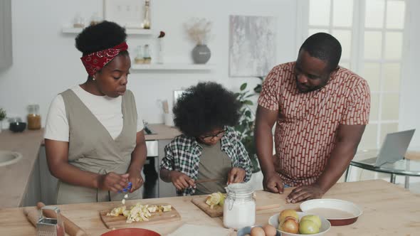 African-American Family Cooking Together at Home