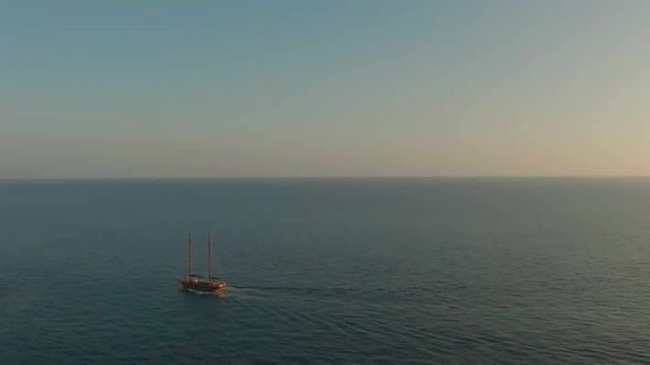 A lone boat sailing in the big beautiful blue ocean