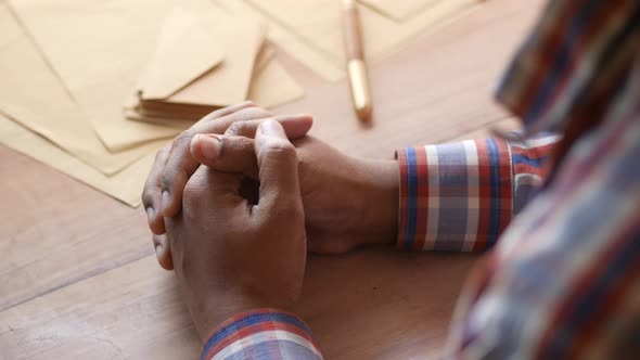 Close Up of Young Man Hands on Table