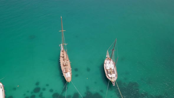Aerial view of two traditional boats in the mediterranean sea.