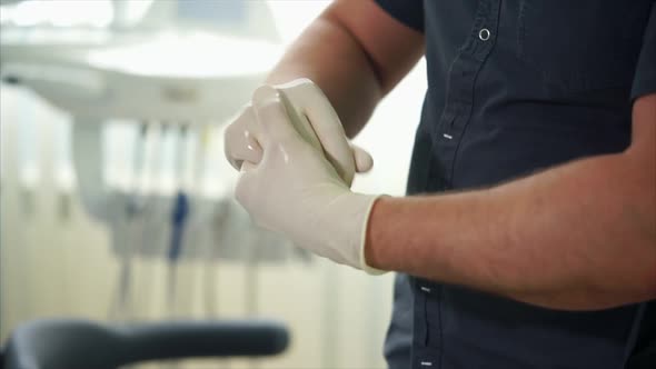 Close Up Shot of a Man's Hands in Gloves Who Treats Their Antiseptics
