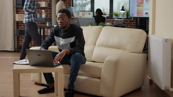 Male Entrepreneur Waving at Videocall Meeting Webcam