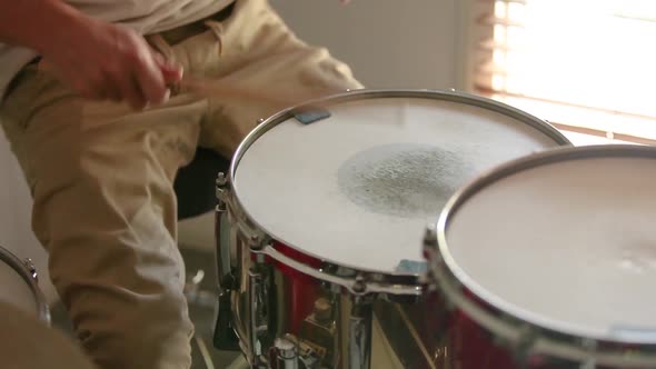 Drummer playing paradiddle rudiment in fast forward.