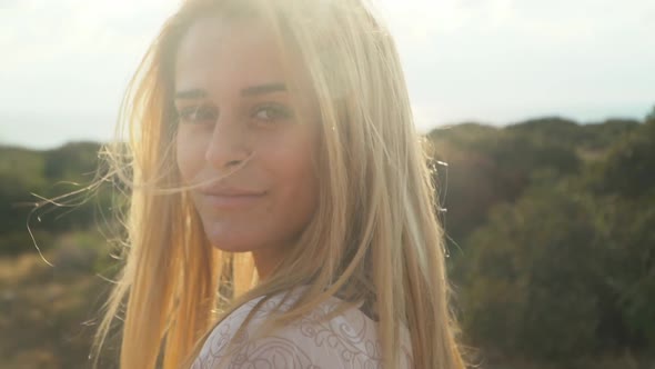 Portrait of Young Beautiful Woman with Amazing Long Blond Hair