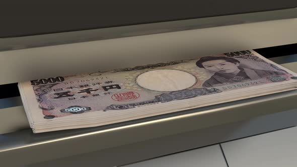 5000 Japanese yen in cash dispenser. Withdrawal of cash from an ATM.