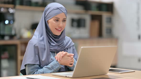 Online Video Chat on Laptop By Arab Woman at Work 