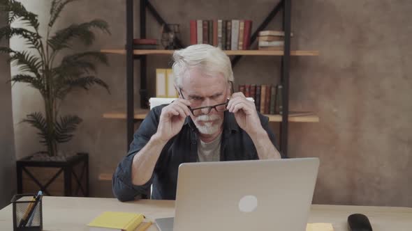 Fatigued Mature Old Man Taking Off Glasses Suffering From Tired Dry Irritated Eyes After Long