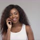 Delighted Black Woman Speaking on Smartphone - VideoHive Item for Sale
