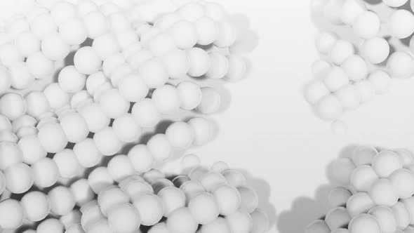 3D spheres moving against white background alt