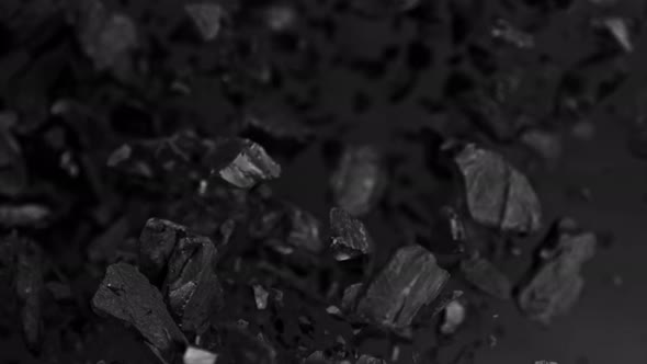 Super Slow Motion Shot of Coal Explosion Isolated On Black Background at 1000 Fps.