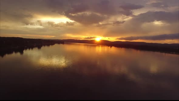 Sunset or sunrise aerial on wide river.